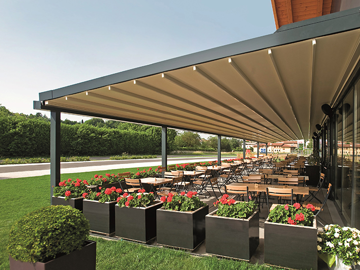 pergola over large seating area with flowers